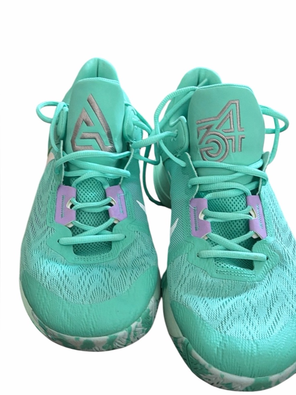 Nike Giannis Immortality 2 basketball shoes in a light menta and lilac colorway.